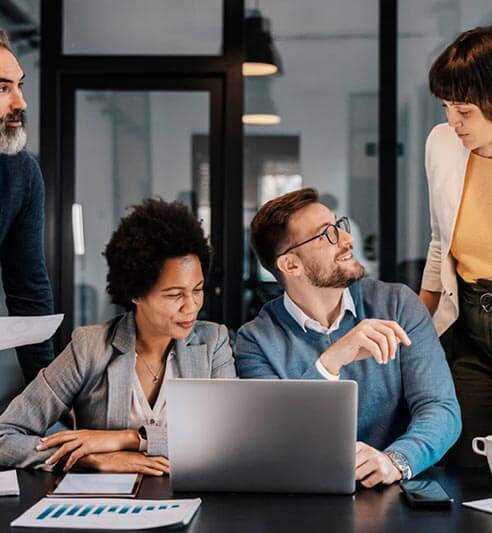 Artinf Graphics & Digital Studio team working on creative design projects